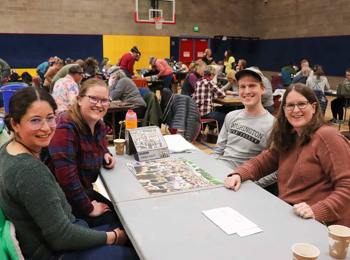 Puzzle and Pie Night out team with completed puzzle.