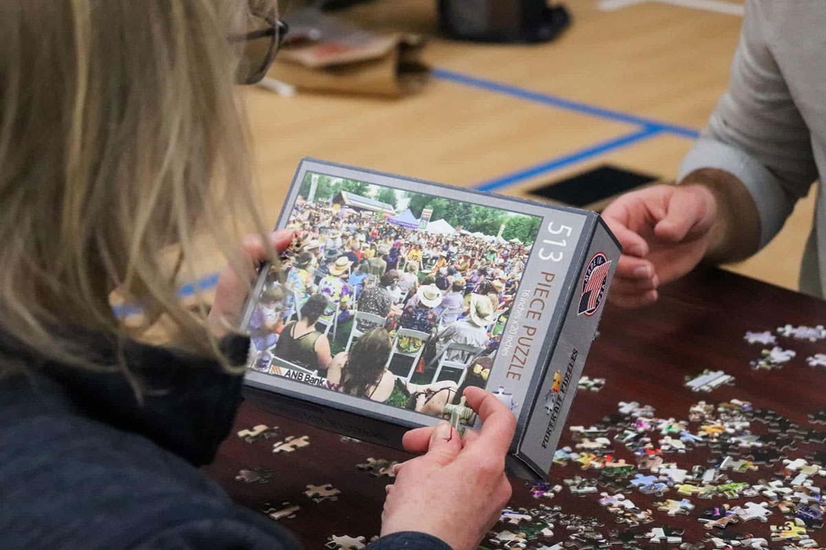 Puzzle and Pie Night Out participant completing a puzzle